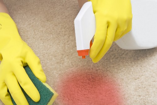 Cleaner preparing a deep cleaning service checklist for a Fulham property