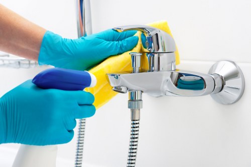 Cleaner using protective gear during a deep cleaning task