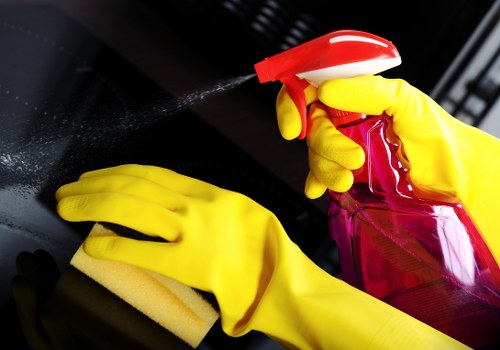 Local cleaners working in a Fulham apartment kitchen and living area